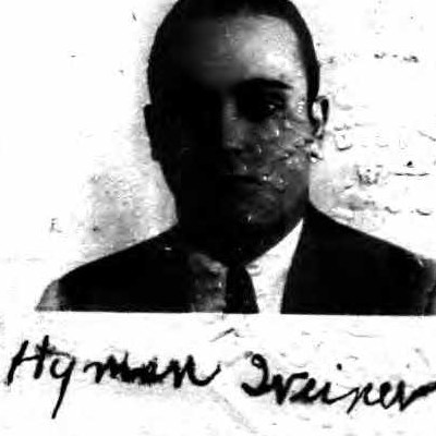 Small photograph of a young man in a suit and tie, signed Hyman Weiner